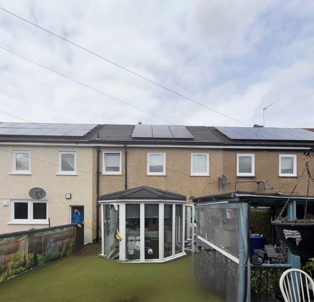 Solar panels across the rear of a terrace row